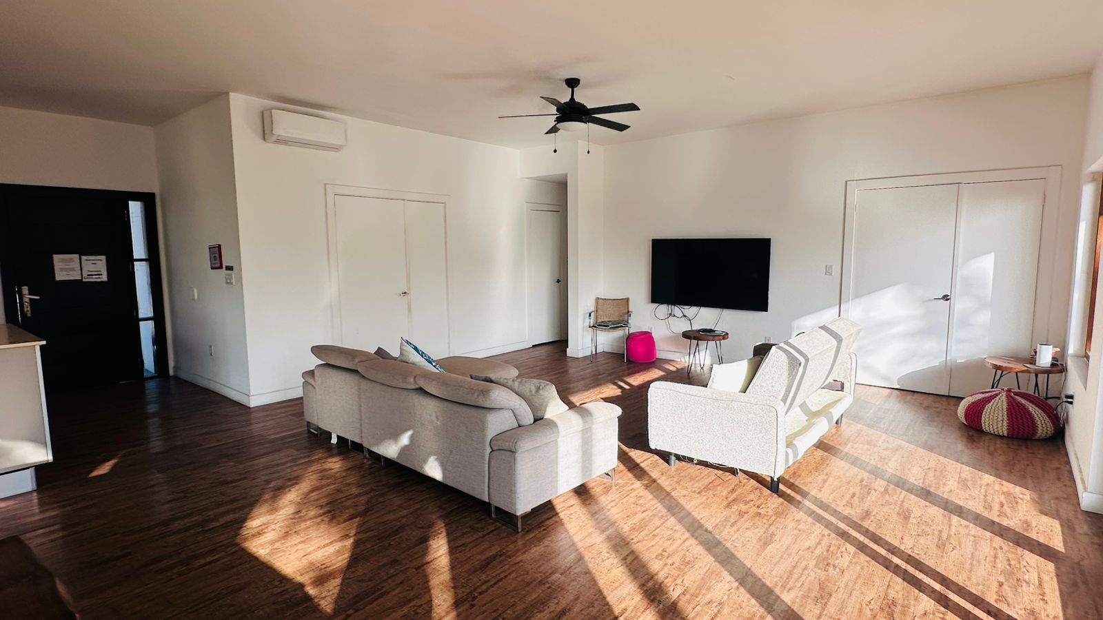 Sunlit wide living area with floor-to-ceiling light