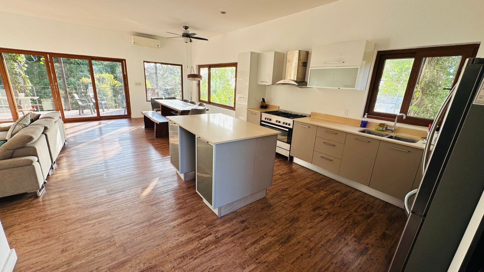 Open-plan living area flooded with natural light at Gemini II